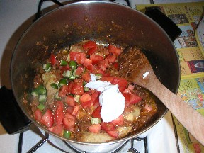 Add tomato and green chilli